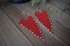 These gorgeous long red beaded earrings are made with high quality Japanese, Czech glass seed beads and Gold tone ear wire hooks. Other finishes are also available.  5" inches in length 1 1/4 " wide *All orders are shipped within 3-7 business days (after the order has been placed) by first class mail with a tracking information. If you need sooner please let me know. All custom orders will be shipped within 1-2 weeks. *All pieces are handmade and each piece is unique and should be handled with c Handmade Red Beaded Long Drop Earrings, Handmade Red Long Drop Beaded Earrings, Red Long Drop Beaded Earrings, Red Faceted Beads Earrings For Festive Occasions, Red Round Bead Earrings For Festivals, Red Long Drop Beaded Earrings As Gift, Red Long Drop Earrings With Dangling Beads, Red Long Drop Beaded Earrings For Gift, Elegant Red Beaded Earrings For Festival