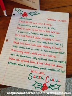 a christmas letter to santa claus on a desk