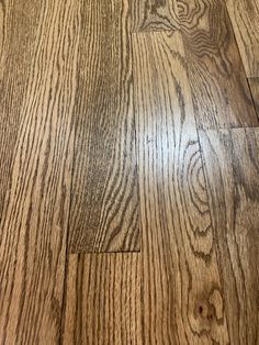 an image of wood flooring that looks like it has been cleaned and is very shiny