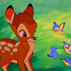 the fawn is surrounded by little birds