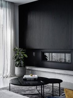 a living room with black and white decor