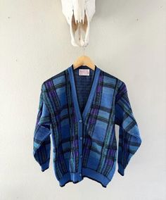 Vintage 1980s Pendleton 100% Pure Wool Plaid Knitted Cardigan / Blue / Made In USA / Button Up / Sweatshirt. Vintage Pendleton Purple Blue Plaid Cardigan Sweater Virgin Wool Knit S USA Made. Unique buttons. Medium. L: 23.5" underarm to underarm: 20".  Check out the rest of our shop: https://instagram.com/hollyshopvintage?igshid=OGQ5ZDc2ODk2ZA== https://hollyshopvintage.etsy.com/ Orders over $35 ship for free. Please check out my Instagram for my newest finds: Hollyshopvintage  Everything priced over $35 has shipping already included in the total price. I'll gladly combine shipping on multiple items to save you money, when it is safe to do so! Message me to make adjustments ahead of time, or make your purchase and I'll refund the shipping overages.  Most items are Vintage. Expect some vinta Unique Buttons, Plaid Cardigan, Sweatshirt Vintage, Wool Knit, Knitted Cardigan, Wool Plaid, Vintage Wear, Blue Plaid, Cardigans For Women