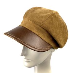 Baker boy cap made of cotton velour and genuine brown leather visor. Inspired by the early 20th century newspaper delivery boys. Its large visor protects us from the sun, cold and rain. The length of the visor is 6 centimeters. The interior is made of a cotton lining The back of the cap has a small eco-leather belt to adjust the measurement up to three centimeters less. For its production we use top quality real leather, reinforcements to give consistency to the hat and top sewing threads. In ou Leather Flat Cap Hat For Fall, Leather Flat Cap For Fall, Retro Leather Cap, Winter Leather Baseball Cap, Retro Brown Beret For Fall, Classic Brown Beret For Fall, Brown Retro Beret For Fall, Leather Cap For Fall, Classic Brown Baseball Cap For Winter