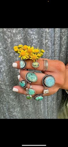 Turquoise handcrafted rings often feature vibrant blue to green stones, sometimes with intricate veining or matrix patterns. The stones are usually set in sterling silver, with detailed metalwork that may include filigree, engraving, or stamped designs. The settings often showcase traditional Native American or Southwestern styles, with motifs such as feathers, arrows, or floral patterns. Each ring is unique, highlighting the natural beauty and variations of the turquoise stones. The craftsmansh Vintage Chrysocolla Turquoise Ring, Artisan Turquoise Gemstone Ring, Artisan Turquoise Ring Jewelry, Southwestern Turquoise Cabochon Rings, Bohemian Style Round Emerald Ring, Bohemian Round Emerald Ring, Bohemian Turquoise Jewelry With Patina, Bohemian Sterling Silver Turquoise Ring With Eco-friendly Gemstones, Unique Turquoise Chrysocolla Ring