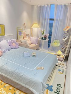 a bed room with a neatly made bed and lots of pillows on top of it