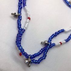 Red white and blue Yemonja / Yemaya inspired colors. Wear these in you waist for adornment and to signify the blessings of the ocean. Waist beads have rhinestone beads placed around l, which add extra sparkle and shine. This is going to look good on you waist. send your waist measurement upon ordering Adjustable Blue Patriotic Necklace, Patriotic Blue Beaded Necklaces, Patriotic Beaded Necklace For Gift, Patriotic Blue Beaded Necklace For Gifts, Patriotic Blue Beaded Necklace For Gift, Blue Patriotic Necklace For Gift, Patriotic Blue Beaded Necklace, Patriotic Blue Necklace For Gift, Patriotic Blue Jewelry With Colorful Beads