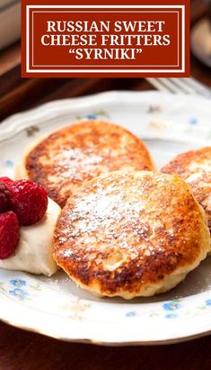 russian sweet cheese fritters with raspberries on a plate