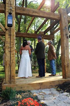 the bride and groom are getting married on the porch