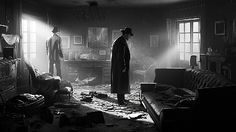 two people standing in a dark room with light coming through the windows and debris on the floor