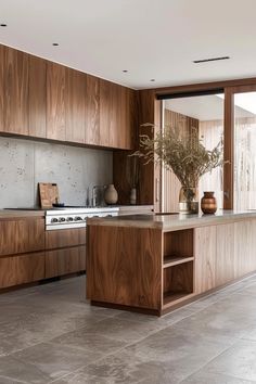 a kitchen with wooden cabinets and an island