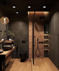 a bathroom with two sinks, a toilet and a shower in the middle of it