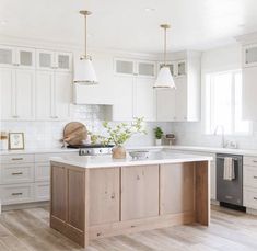 the kitchen is clean and ready for us to use it's counters are made of wood