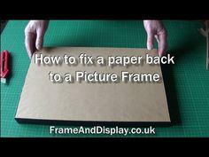 someone is making a paper back to a picture frame