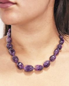 This gorgeous necklace features natural amethyst crystals, in graduating sizes, hand knotted with a silver clasp. Amethyst is a powerful crystal which helps calm the mind while offering powerful meditative and spiritual powers. This elegant healing necklace sits at just the right length on your neckline and completes any look with a royal touch. Amethyst is connected to balancing of the crown chakra and has healing powers to help with physical ailments, emotional issues and balancing. Amethyst c Classic Amethyst Purple Necklace, Classic Purple Amethyst Necklace, Elegant Purple Faceted Beads Gemstones, Classic Beaded Necklaces With Gemstone Beads, Purple Gemstone Rondelle Beaded Necklaces, Purple Rondelle Gemstone Beaded Necklaces, Elegant Amethyst Beaded Necklaces For Healing, Elegant Amethyst Beaded Necklace For Healing, Elegant Single Strand Amethyst Beaded Necklace