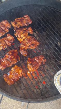 chicken wings are cooking on the grill