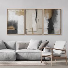 a living room with three paintings on the wall