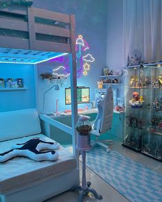 a bedroom with a bed, desk and shelves filled with stuffed animals on the walls