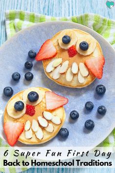 two pancakes with blueberries and almonds on a plate stock photo image of food