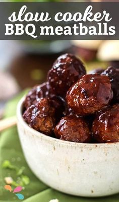 a white bowl filled with meatballs on top of a table