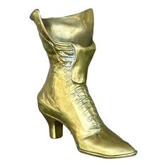 Step into timeless charm with our Vintage Boho Brass Victorian Boot. This ornate piece combines Victorian elegance with bohemian flair, making it a unique and stylish accent for any room. Victorian Elegance, Victorian Boots, Figurative Sculpture, Vintage Boho, Figurative, Decorative Objects, Brass, Sculpture, Boots