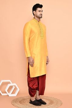 Yellow straight kurta with floral embroidered placket. Paired with a maroon draped dhoti pant. - Aza Fashions Festive Slub Silk Sherwani With Traditional Drape, Bollywood Style Kurta For Traditional Ceremonies, Festive Traditional Drape Sherwani In Slub Silk, Slub Silk Kurta For Puja And Festivals, Slub Silk Kurta For Puja, Diwali Cotton Silk Kurta With Embroidered Border, Resham Embroidered Churidar For Puja, Traditional Drape Cotton Silk Kurta For Ceremonies, Traditional Drape Kurta For Ceremonies