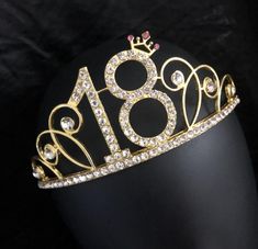 a gold tiara with the number eighteen on it's side and diamond detailing