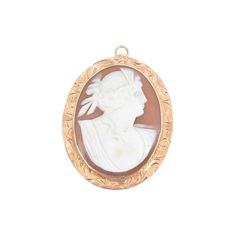 Brooch Victorian Shell 9k Gold Cameo Brooch Pendant - Victorian brooch/pendant bezel-set with a large hand-carved shell cameo with the profile of a young woman. 9K yellow gold frame accented with scroll details. COLOR: gold/light brown CONDITION: Very Good; some wear DIMENSIONS: 1.25" W x 1.75" H ERA: Antique: 19th century MADE OF: 9k gold/shell depth is an estimate Due to the unique nature of this product, all sales are final. This item is not eligible for the standard Chairish return policy. Art Deco Shell, Victorian Brooch, Earrings Ideas, Gold Chains For Men, Carved Shell, Casting Jewelry, Cameo Brooch