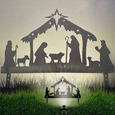 a nativity scene with the birth of jesus and three wise men in silhouettes