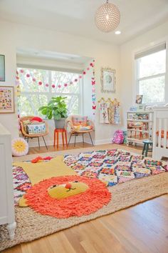 a brightly colored rug in the middle of a room with lots of furniture and decor