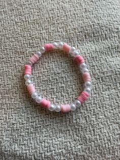 Handmade bracelet with pink clay beads and faux pearls Pink Clay Bracelet Ideas, Pink Beaded Round Pearl Bracelet, Adjustable Pink Pearl Bracelet With Spacer Beads, Elegant Pink Beaded Bracelets For Beach, Pink Pearl Bracelet With Colorful Beads, Handmade Pink Pearl Bracelet, Elegant Pink Bracelets For Beach, Pink Adjustable Pearl Stretch Bracelet, Adjustable Pink Pearl Stretch Bracelet