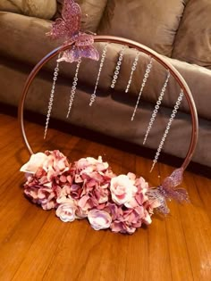 a flower arrangement in the middle of a wooden floor