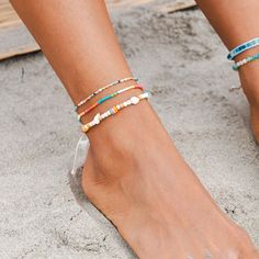 Introducing our Beachcomber Anklets! Crafted with genuine seashells and featuring an adjustable pull-through closure, these anklets guarantee a perfect fit for all. Easy to slip on and off, they effortlessly infuse your look with beachy coastal charm. Adjustable Beaded Bracelets For Beach Season, White Ankle Wrap Anklets For Beach, Adjustable Coastal Beaded Bracelets For Summer, Ocean-inspired Beaded Anklets For Summer, Summer Ocean-inspired Beaded Anklets, Adjustable Beaded Beachy Anklets, Beaded Ankle Wrap Anklets For Beach, Beachy Shell Beaded Bracelets For Summer, Beaded Ankle Wrap Anklets For Beach Season