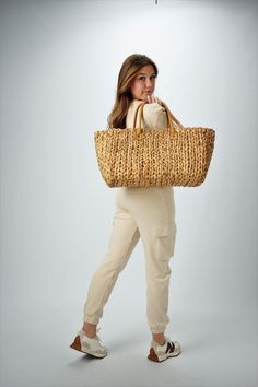 This extra large straw tote is woven from natural hyacinth and has two over-sized leather handles for carrying everything from beach gear to vintage finds. Neutral, classic and spacious, it can do it all. Content:- Hyacinth Straw - Leather- Linen Lining- Imported Size:- Width: 18.5" - Height: 11.25"- Depth: 9"- Handle Drop: 7.5" Straw Beach Bag With Rolled Handles, Straw Beach Bag With Rolled Double Handles, Casual Beige Straw Bag With Rolled Handles, Straw Bag With Rolled Double Handles, Travel Straw Bag With Rolled Handles, Beige Straw Bag With Rolled Handles For Vacation, Natural Straw Beach Bag With Rolled Handles, Casual Beach Basket Bag With Rolled Handles, Beige Straw Shopping Bag With Rolled Handles