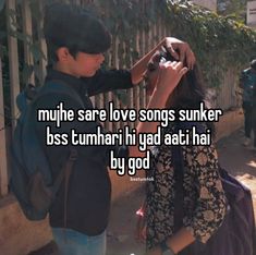 two people standing next to each other in front of a fence with the words muffle sare love songs sunken