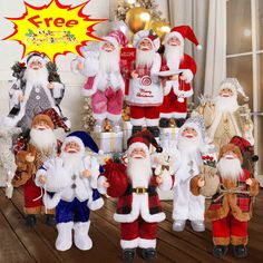 a group of santa clause figurines standing next to each other in front of a christmas tree