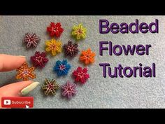 the beaded flower is being made with beads