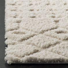 a white rug on top of a black table