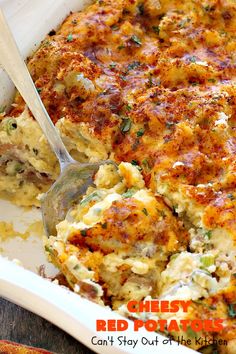 a casserole dish with meat and cheese in it is being eaten by a spoon