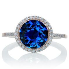 a blue ring with diamonds around it