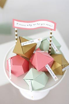 small origami pieces on a plate with a sign that says, you're going to get married