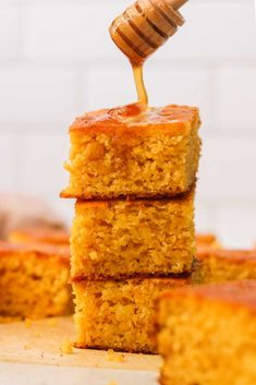 honey being drizzled on top of cornbreads