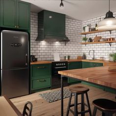 an image of a kitchen setting with green cabinets and wood counter tops on the island