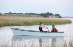 two people in a small boat with the words let's stay here forever