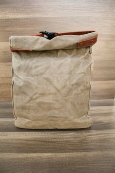 Our kibble bag was designed to last! They are made with 16oz waxed canvas and lined with a BPA free waterproof lining. Extra strong stitching, a smooth antique brass YKK zipper, a YKK buckle, and faux leather strapping that is so soft, yet durable! Each kibble bags holds approx. 40 cups of dry food. It can also be used for dehydrated or jerky style dog food, a treat bag for on the road (think a bunch of smaller treat bags), and more! Every kibble carrier comes with a 1 cup stainless steel measur Practical Lunch Bag With Zipper, Practical Lunch Bag With Zipper For Everyday, Khaki Standard Backpack With Canvas Lining, Khaki Canvas-lined Standard Backpack, Khaki Waxed Finish Standard Backpack, Khaki Backpack With Waxed Finish, Khaki Waxed Finish Backpack, Practical Brown Canvas Bag With Canvas Lining, Khaki Waxed Canvas Bag With Waxed Finish