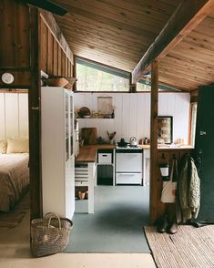 an open kitchen and dining area in a small cabin