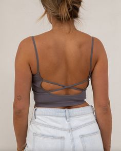 ~ 72% Modal 24% Nylon 4% Spandex ~ Seamless ~ Open back criss cross straps ~ Model is 5'9" wearing a size S/M Fitted Tank Top With Built-in Bra And Cross Back, Fitted Crisscross Crop Top With Built-in Bra, Strappy Back Stretch Camisole With Built-in Bra, High Stretch Tops With Built-in Bra And Cross Back, Casual Crop Top With Built-in Bra And Strappy Back, Spring Tops With Built-in Bra And Strappy Back, Fitted Crisscross Top With Built-in Bra, Fitted Tank Top With Built-in Bra And Strappy Back, Strappy Stretch Tank Top With Built-in Bra