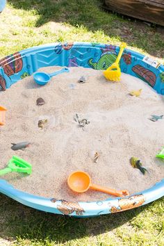 an image of a birthday party with sand and toys