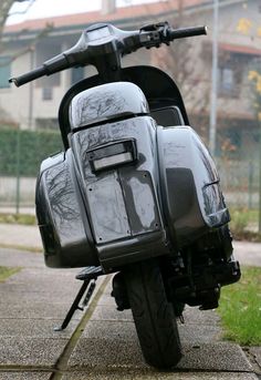 the motorcycle is parked on the side of the road