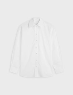 Crisp poplin shirt
 100% cotton
Oversized cut based on a men's shirt
 Shirt collar
 Beveled cuffs with button placket
 Rounded hem with shirttail and hem gussets
 Shoulder yoke with two flat pleats

 REF: 07FCHDELINAXCO1217
 Size: XS, S, M, L