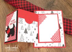 two christmas cards with red and black plaid paper on them, one has a card in the shape of a scottie